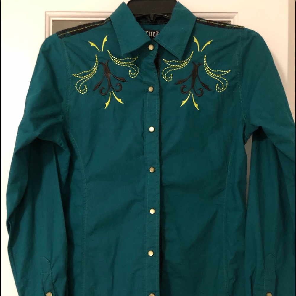 One of a kind women’s button up shirt.